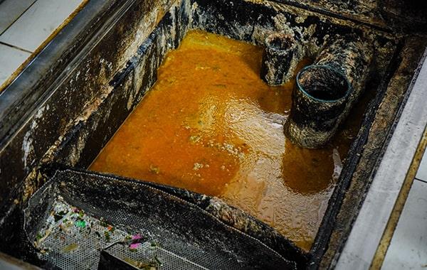 regular grease trap cleaning helps prevent grease and oil from contaminating water sources